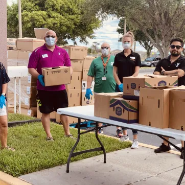 The YMCA of the Suncoast's West Pasco branch, located at 8411 Photonics Dr. in Trinity, works with Feeding Tampa Bay to hand out food to needy families on April 6, 2020. 